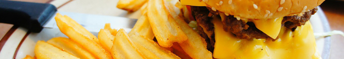 Eating American (Traditional) Burger Hot Dog at Burger & Shake restaurant in Flowery Branch, GA.